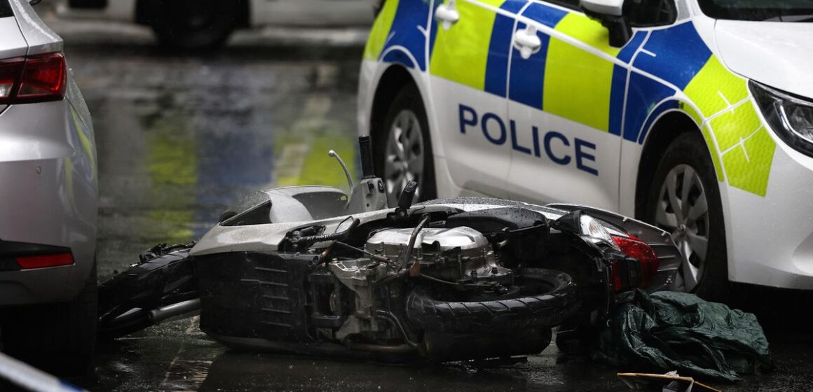 Two police officers viciously attacked with a knife in the street while dealing with moped crash