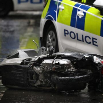 Two police officers viciously attacked with a knife in the street while dealing with moped crash